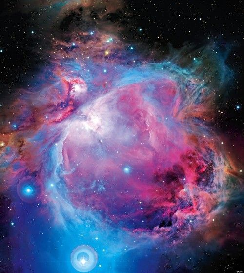 Once thought to be part of the Orion nebula, the star cluster NGC 1980 is actually a separate entity, scientists say. It appears around the brightest star seen at the bottom of this image, iota Ori. The disks around the star are the result of internal light reflection in the camera optics. Scientists using the Canada-France-Hawaii Telescope in Hawaii found that the star cluster NGC 1980 is a distinct, massive bunch of stars in front of the Orion nebula, which at a range of 1,500 light-years is Earth's closest known star factory. The cluster is huddled unevenly around the star iota Ori at the southern tip of the sword in the famedOrion constellation. 										(Image: CFHT/Coelum J.-C. Cuillandre & G. Anselmi)